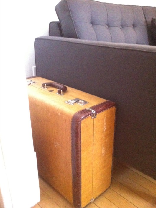 Vintage suitcase as art supplies storage